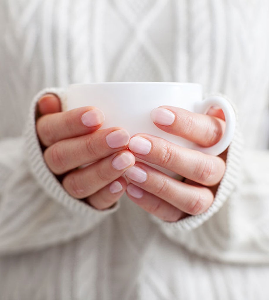 Woman holding a mug of tea