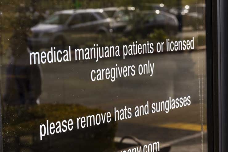 A sign on the door of a medical marijuana dispensary. (Jonathan Weiss/Shutterstock)