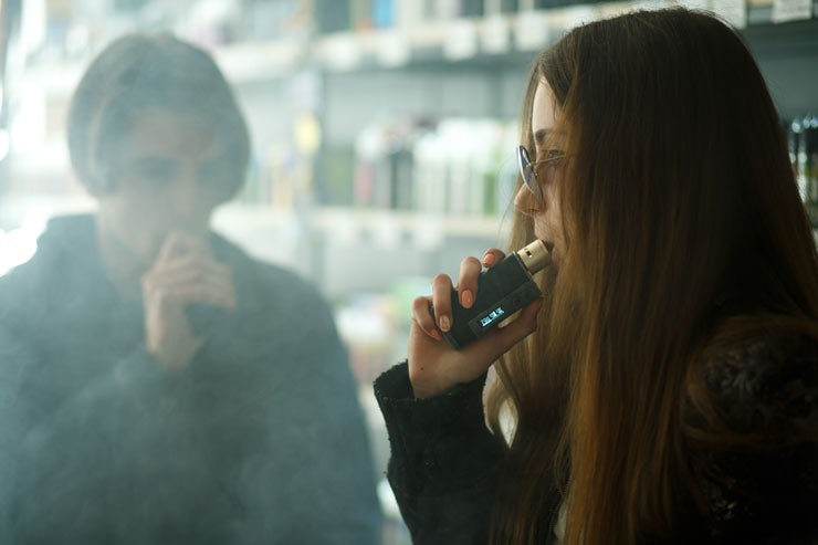 Teenagers using vaporizers 