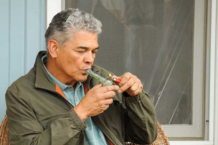 older man smoking cannabis