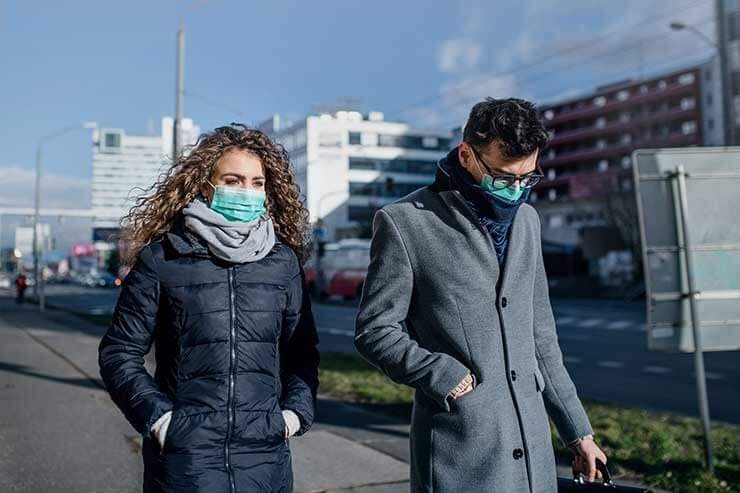 Man and woman wearing surgical masks corona virus