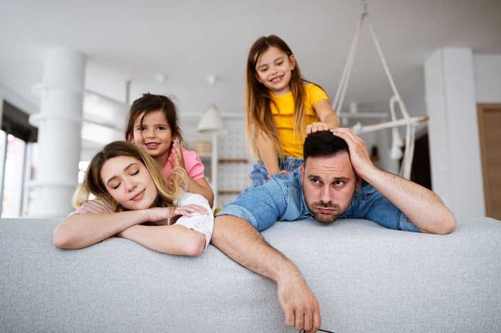Tired parents with small children