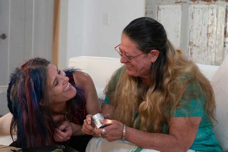 Two mothers laugh after smoking a joint
