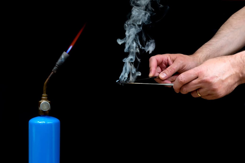 Preparing to smoke hashish by using the hot knife method