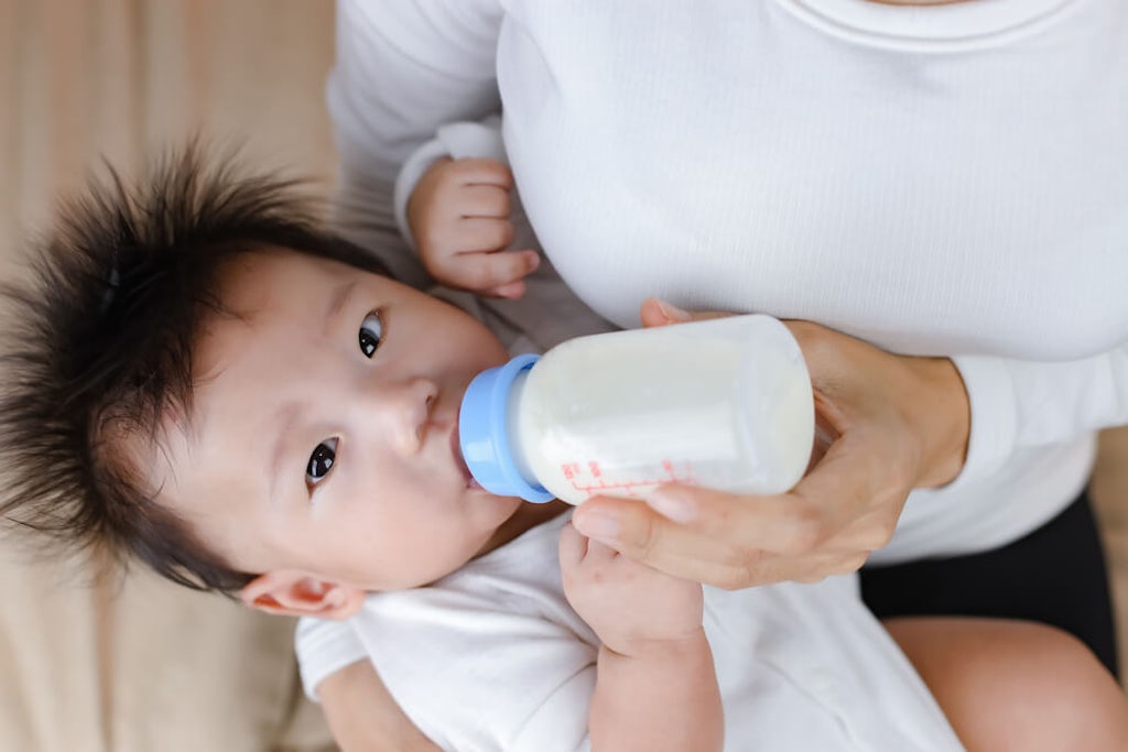 Bottle feeding a baby 