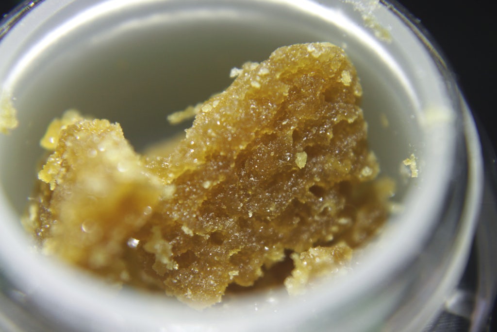 Cannabis wax, an extract, is seen in a small jar