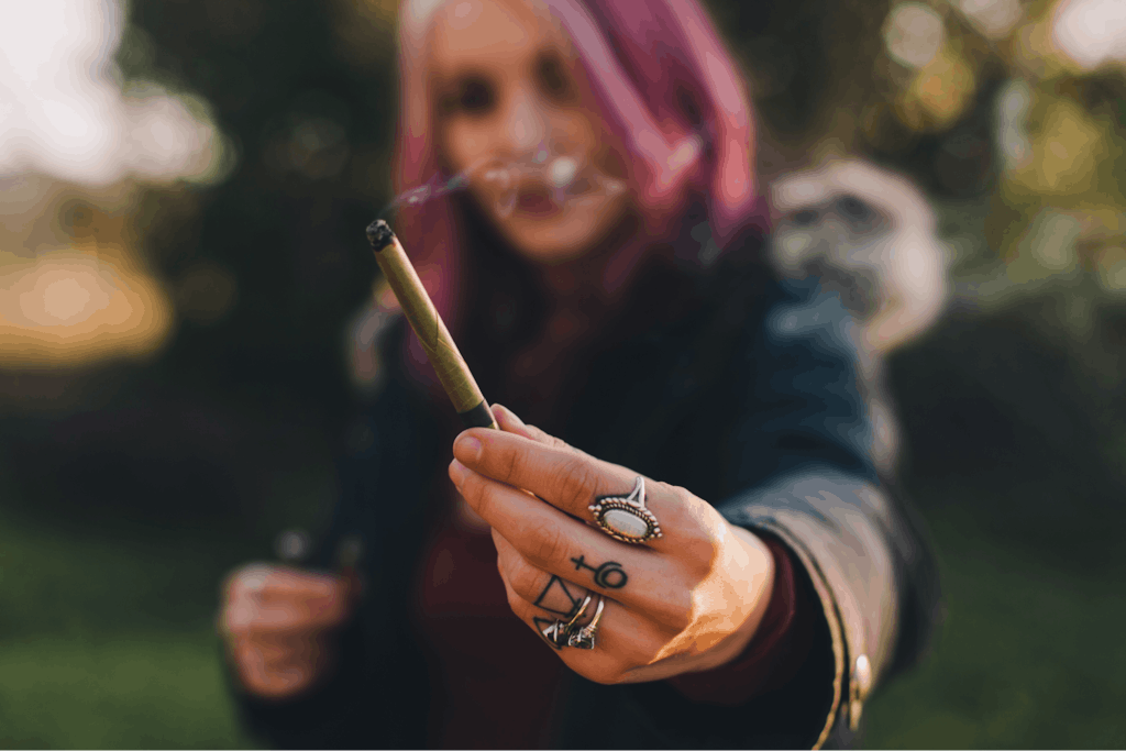 Beautiful woman passing a joint