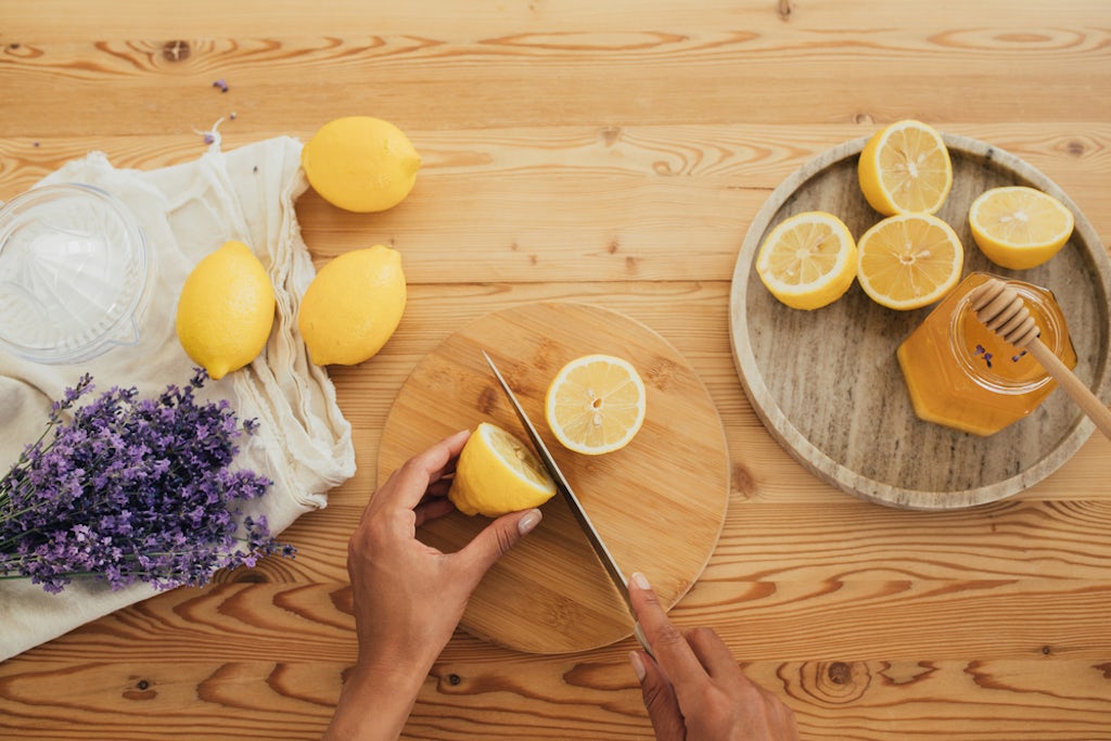 Cutting lemons before squeezing them to make THC-infused lemonade