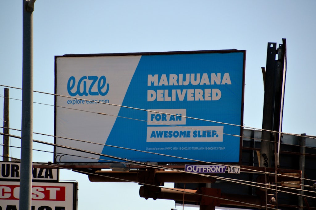 An outdoor advertisement for marijuana delivery service Eaze in Los Angeles, CA